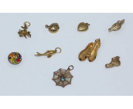 Eight 9ct gold bracelet charms including ballet slippers, kettle, genie lamp, basket of fruit, fish, deer with fawn, boot, he