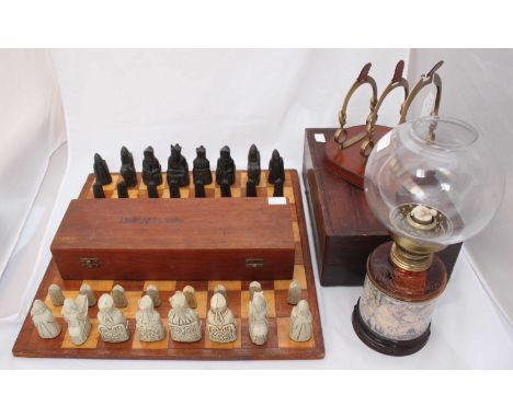 A complete set of ornately moulded resin chess pieces and wooden chess board, together with a leather and brass desk letter r