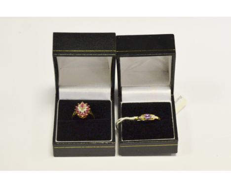 A 9ct gold ring, central purple amethyst set between marcasite diamonds, stamped 375; a 9ct gold ladies dress ring (2)  