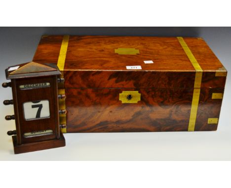 A Victorian mahogany and brass bound writing slope; an early 20th century perpetual desk calendar; an early 20th century copp