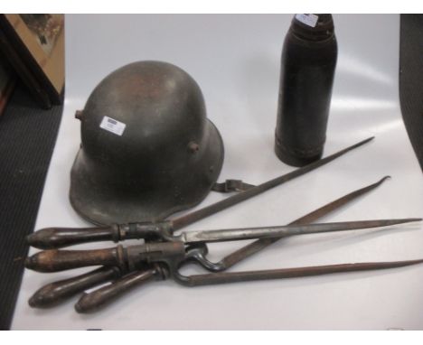 A WW1 period German helmet with original green paint lacking liner, together with a deactivated WW1 shell and four late Victo