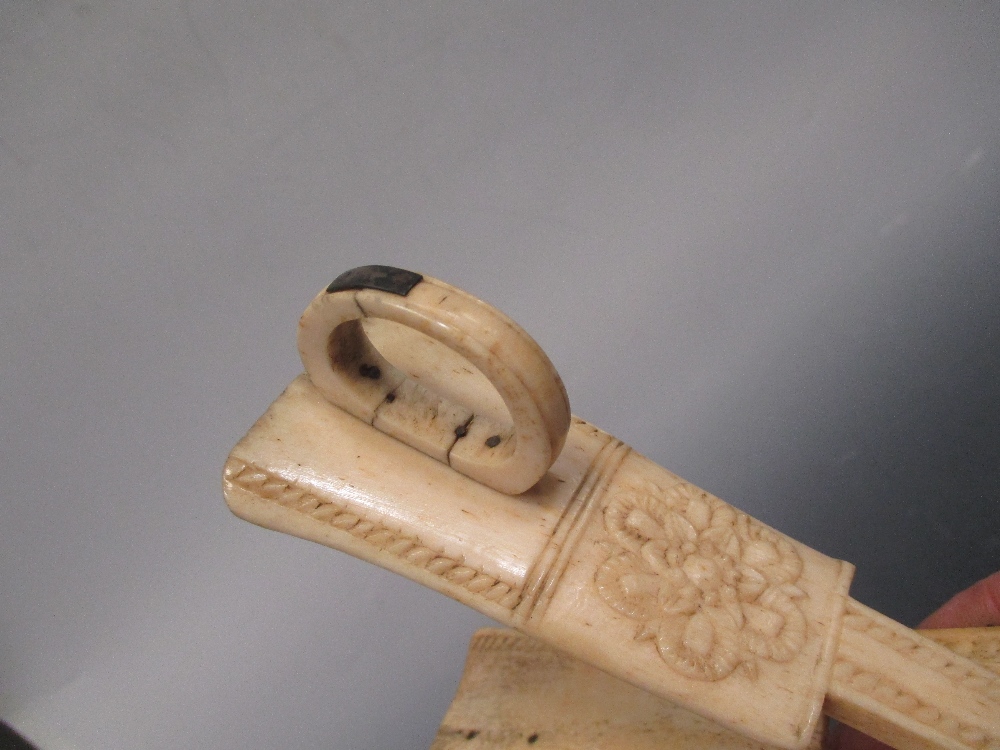 Ninteenth century carved bone tongs in Cheffins Fine Art