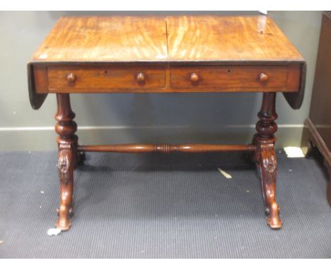 A Late Georgian mahogany sofa table with crossbanded and inlaid decoration, two drawers above turned column supports on four 