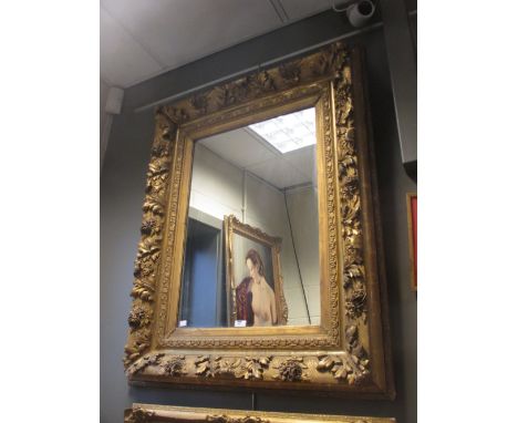A gesso gilded portrait frame with mirror, sight size 69 x 49cm, overall size 107 x 85cm  
