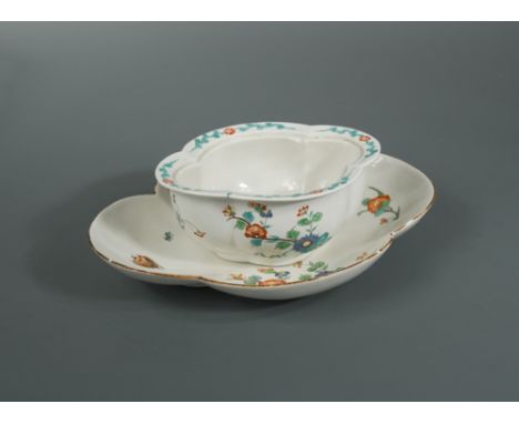A Chantilly tureen base and associated stand, circa 1735, each painted in the kakiemon style with a large beetle and flowerin
