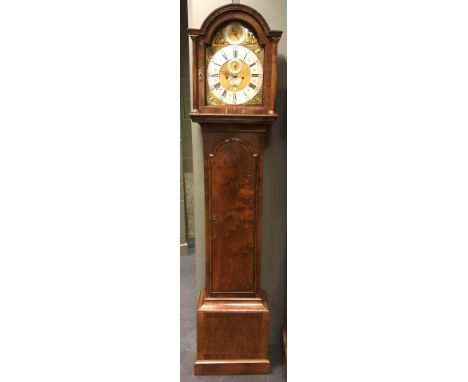 A George III walnut longcase clock circa 1760, the break arch hood with three ball finials, 12inch (30.5cm) brass dial signed