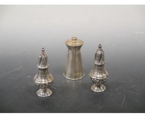 A pair of silver pepperettes and a silver pepper grinder  