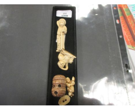 A collection of 4 netsuke , Meiji period and later including a monk touching his head with one hand , a man holding a gourd ,