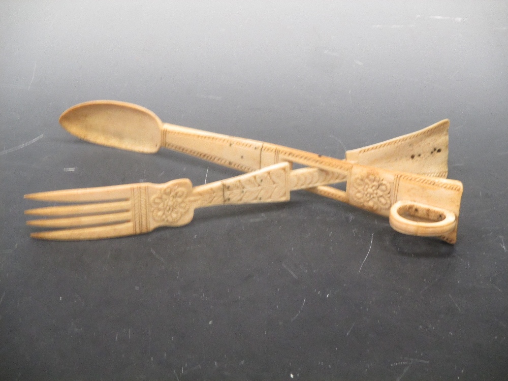 Ninteenth century carved bone tongs in Cheffins Fine Art