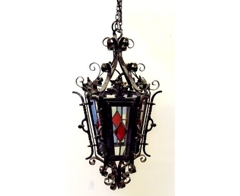 A Victorian wrought iron and stained glass lantern 