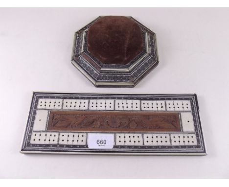 An Indian late 19th century inlaid ivory cribbage board and an octagonal pin cushion - a/f