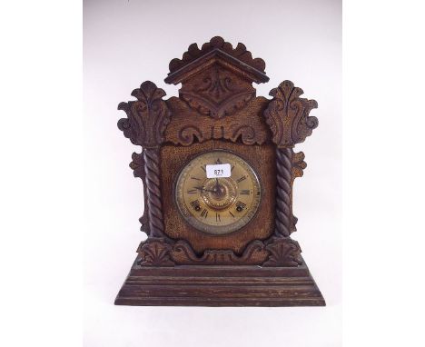 A 19th century oak "Gingerbread" shelf clock 