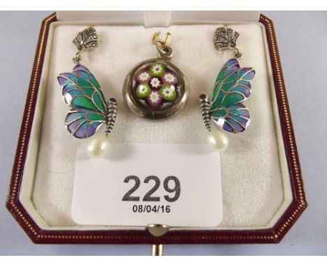 A pair of silver and enamel butterfly earrings with pearl drops and a millefiori glass and silver pendant 