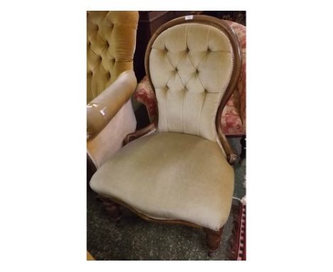 Victorian mahogany framed button back nursing chair, raised on turned front legs 