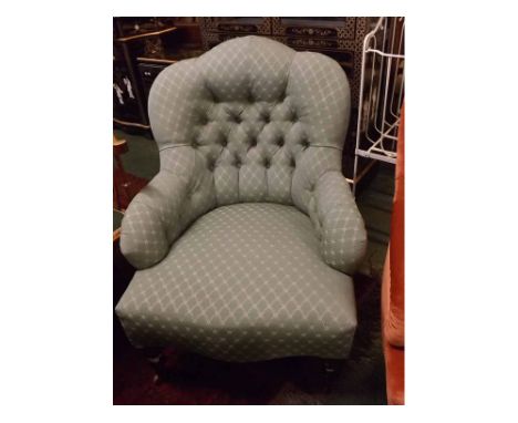 Victorian turquoise upholstered button back armchair, on turned feet  