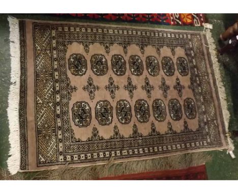 Caucasian small carpet and prayer rug, decorated respectively with lozenges on a pale grey field and with a similar design on