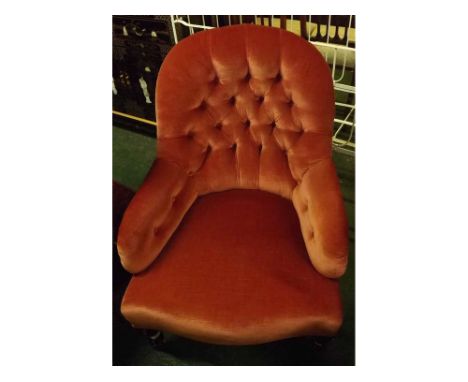 Victorian pink upholstered button back armchair, on turned legs