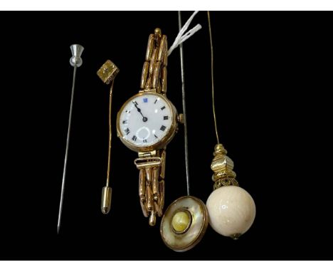 9 carat gold watch with enamel dial, three hat pins and tie pin.