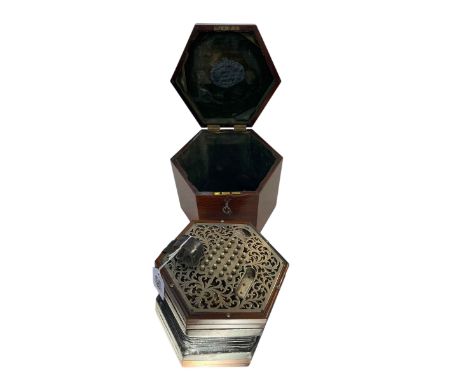 Lachenal Concertina in hexagonal mahogany case with steel pierced ends and 48 steel buttons.
