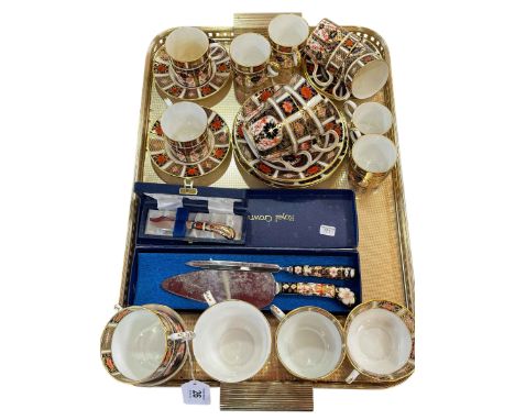 Collection of Royal Crown Derby Imari 1128 pattern, cups, coffee cans, saucers, butter knife, cake slice and letter opener.