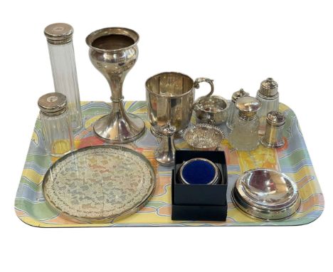 Silver goblet, silver tankard, salts, condiment bottles, two silver topped toilet bottle, pin cushion, etc.