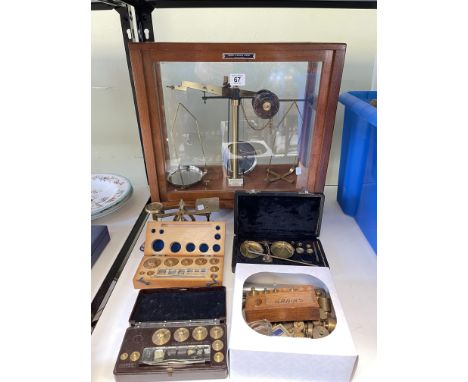 Balance scales in glass case, postal scales, boxed weights, etc.
