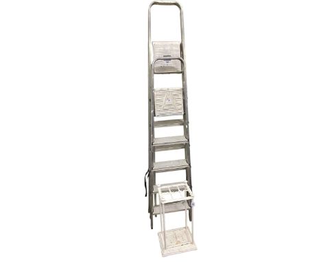 Cast iron six division stick stand and two pairs of aluminium platform steps (3).