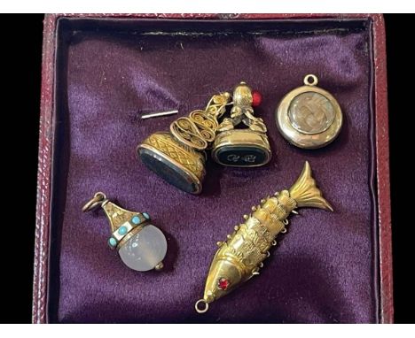 Two hardstone fobs, 14k reticulated fish pendant with ruby set eyes, mourning pendant and another.