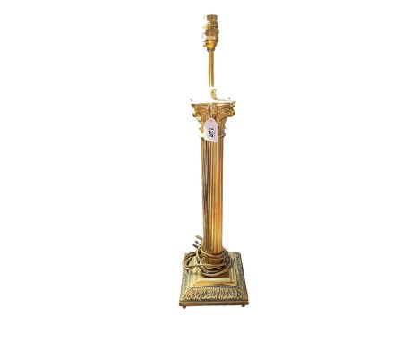 Gilt corinthian column table lamp, 66cm high.