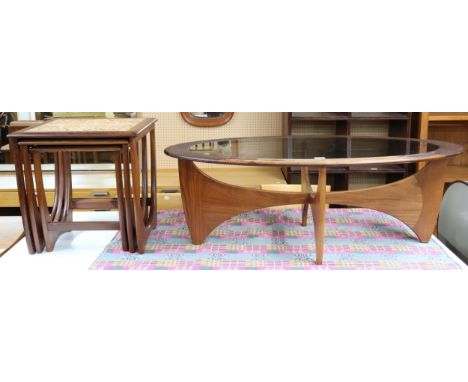 A lot comprising a mid 20th century G Plan "Astro" oval teak framed glass topped coffee table, 40cm high x 122cm long x 66cm 