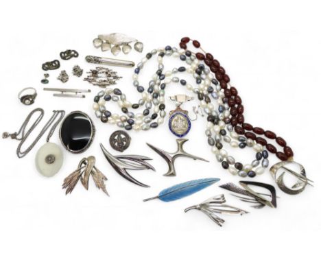 A collection of silver retro brooches to include Just A of Denmark, Thomas L Mott, Ivan Tarratt the brooch signed Ernest A. B