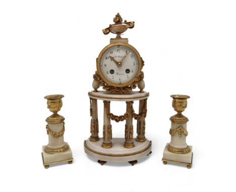 A Le Roy, Paris mantle clock with candlestick garnitures, in white onyx with ormolu mounts Condition Report:Available upon re