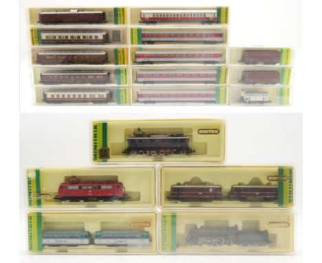 A collection of Minitrix N-gauge model railway locomotives and stock; to include a 12035 steam locomotive and tender; alongsi