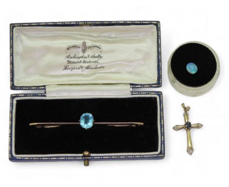 A 9ct gold blue gem set bar brooch, a 9ct gold sapphire and diamond accent cross weight combined 4.1gms, and a loose black op