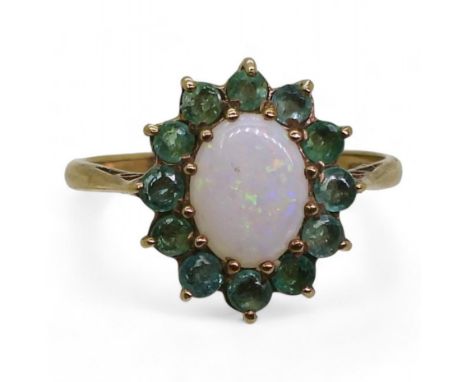 A 9ct gold white opal and emerald cluster ring, finger size N1/2, weight 2gms Condition Report:Available upon request