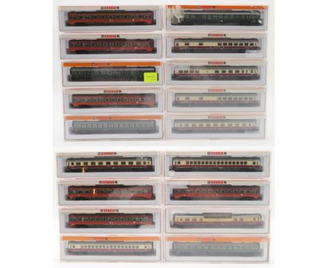 A collection of boxed Arnold N-gauge model railway passenger carriages, to include models 3840 (x2), 3785 (x2), 3810 (x2), 38