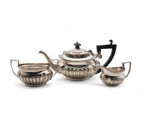 A matched Bachelor's silver tea service, by James &amp; William Deakin, the teapot Chester 1901, the cream jug and sugar bowl