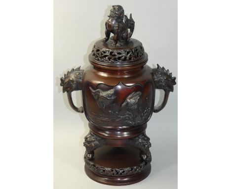 A Chinese bronze censer, with bird, Dog of Fo and two handled rooster head decoration, 44 cm. 