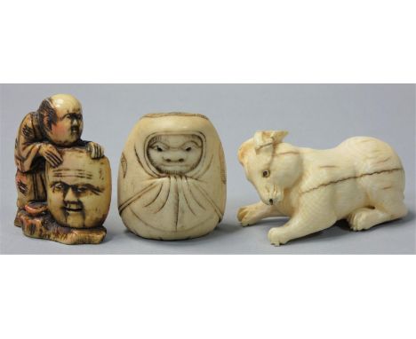 Two Japanese Ivory Netsuke, the first carved as a rabbit, length 4.5 cm, the second as a baby in a blanket and a resin exampl