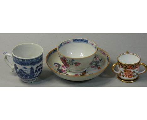 A New Hall tea bowl and saucer, painted with floral decoration. a blue and white coffee cup and a Royal Crown Derby three han