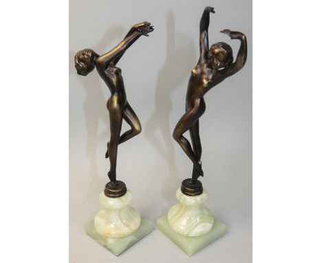 A pair of Art Deco style bronze dancing girl statues, signed Vivian, raised on green marble bases, 25 cm. 