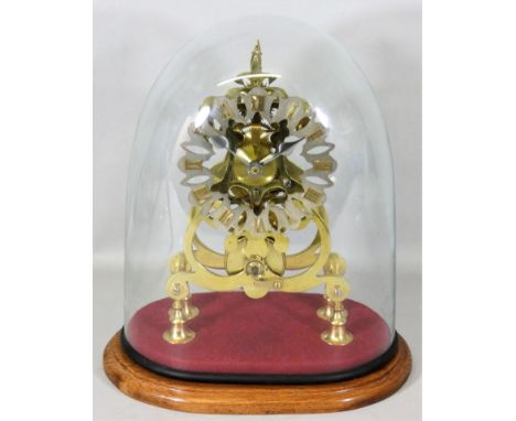 A late 19th century brass Skeleton clock with a pierced silvered chapter ring, with a single fusee movement, glass dome, over