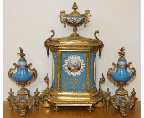 A French gilt metal and Sevres style porcelain clock garniture, retailed by Ducasse Claveau &amp; Co., Paris,  the central pa
