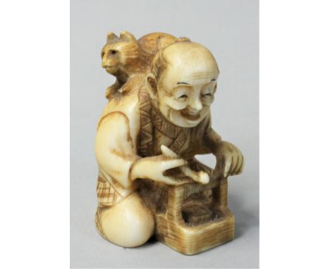 A Japanese Ivory Netsuke, carved in the form of a man with a cat on his back, signed, height 4.5 cm. 