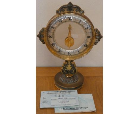 Jaeger Le Coultre; a Mystery gilt metal mantle clock, c. 1965, with silvered chapter ring, visible movement, raised on a pede