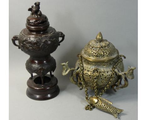 A Chinese bronze censer, with bird decoration, 30 cm and a Chinese brass censer with dragon handles (2). 