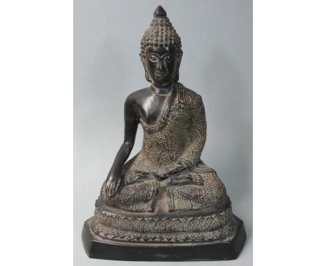 A bronze figure of a seated Buddha, possibly Tibetan, height 20 cm. 