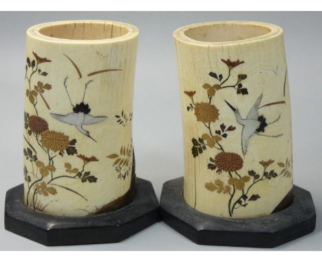 A Japanese pair of ivory and shibayama brush pots, decorated with mother of pearl storks amongst lacquer birds, grass and chr