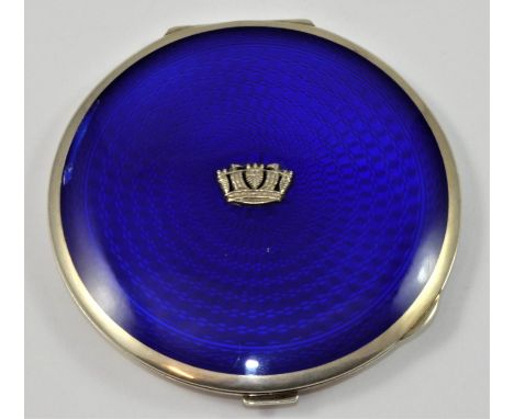 A silver and enamel circular compact, by Adie Bros for Gieves, Birmingham 1934, the blue enamel with applied Naval crown, dia