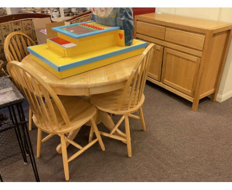 Contemporary light oak two door sideboard, circular beech finish extending table and four chairs (6).